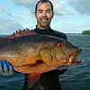 Kevin Weng holding a large fish